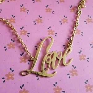 JewelMint Love necklace gold tone cursive script nameplate